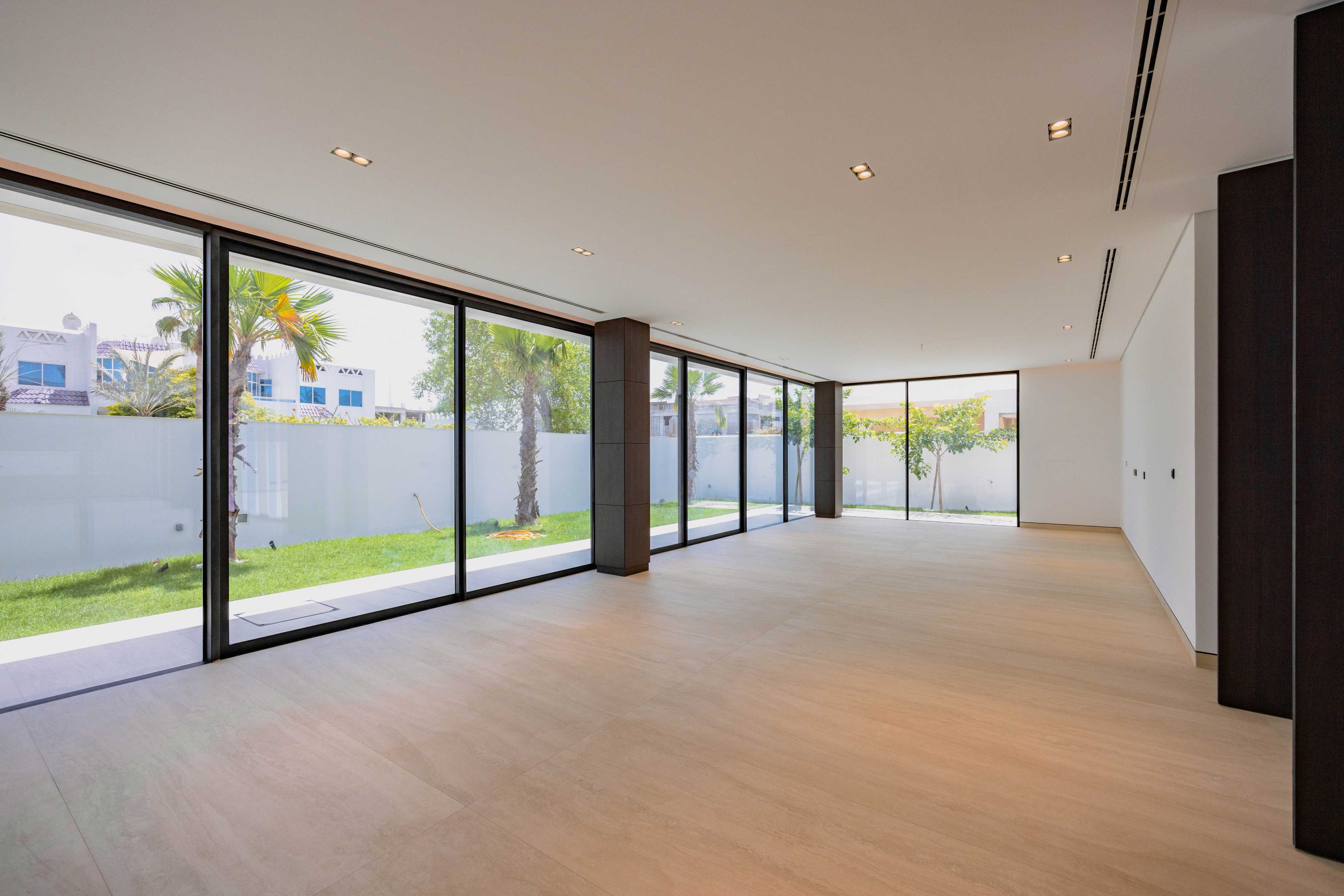 Recessed pinhole downlights in a plaster ceiling